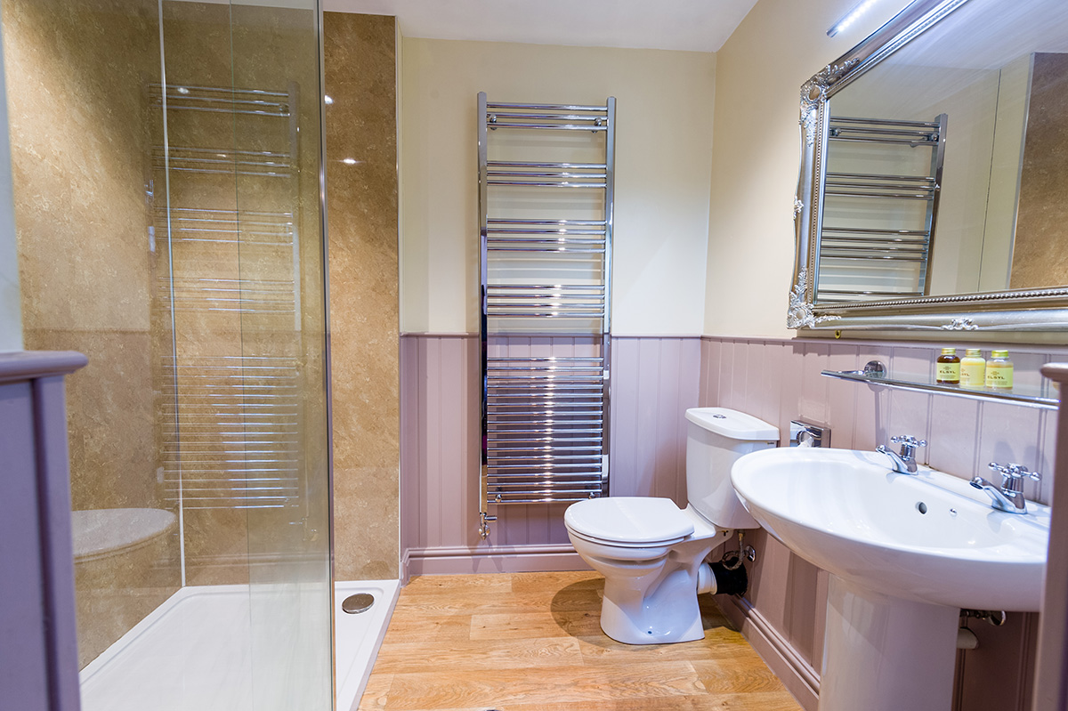 Large bathroom with sink, toilet and shower at Appleby Castle