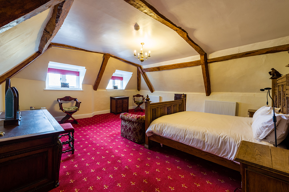 Large bed and antiques in the Russel Suite bedroom at Appleby Castle